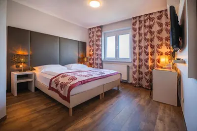Ein Bett oder Betten in einem Zimmer der Unterkunft Arion Airport Hotel