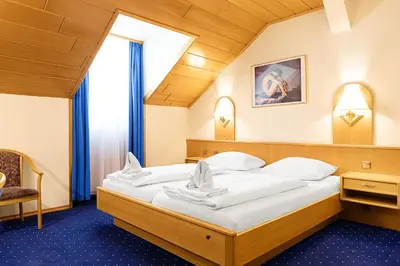 Ein Bett oder Betten in einem Zimmer der Unterkunft Hotel-Pension Wild