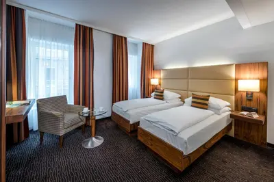 Ein Bett oder Betten in einem Zimmer der Unterkunft Hotel IMLAUER Wien