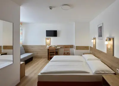 Ein Bett oder Betten in einem Zimmer der Unterkunft Hotel Terminus