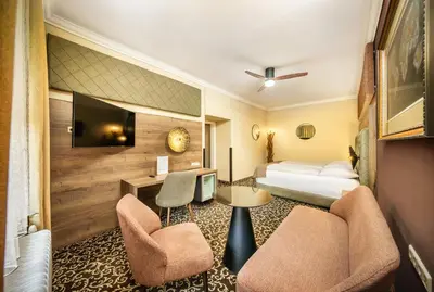 Ein Bett oder Betten in einem Zimmer der Unterkunft Das Gutenbrunn Thermen & Sporthotel