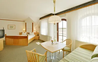Ein Sitzbereich in der Unterkunft Das-Schmidt Privathotel