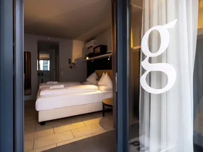 Ein Bett oder Betten in einem Zimmer der Unterkunft grätzlhotel Karmelitermarkt