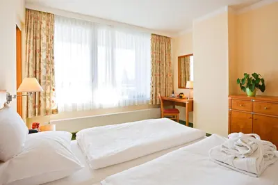 Ein Bett oder Betten in einem Zimmer der Unterkunft Badener Hof