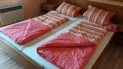 Ein Bett oder Betten in einem Zimmer der Unterkunft Arkadenhaus Steiner