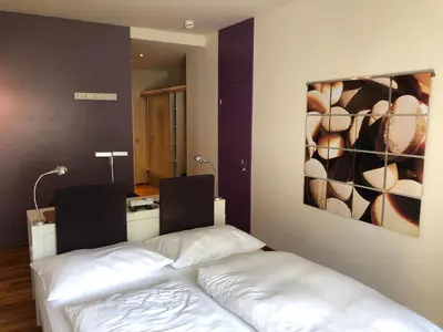 Ein Bett oder Betten in einem Zimmer der Unterkunft Hotel Krainerhütte