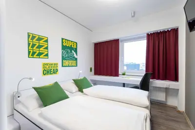 Ein Bett oder Betten in einem Zimmer der Unterkunft SLEEEP Hotel Wiener Neudorf