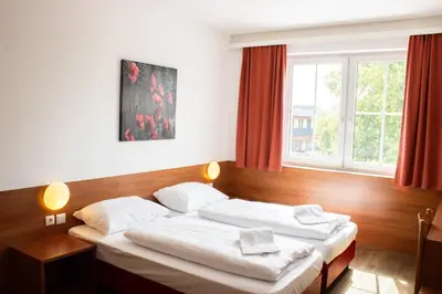 Ein Bett oder Betten in einem Zimmer der Unterkunft OEKOTEL Traiskirchen