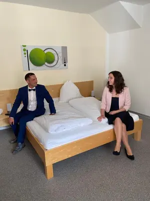 Ein Bett oder Betten in einem Zimmer der Unterkunft Andreashof Mörbisch