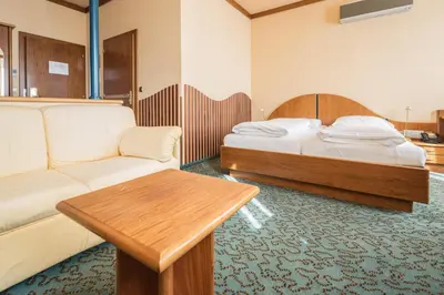 Ein Bett oder Betten in einem Zimmer der Unterkunft Hotel Eitljörg