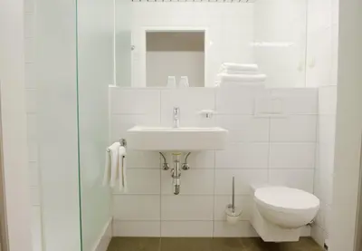 Ein Badezimmer in der Unterkunft Benediktushaus im Schottenstift