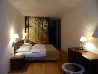 Ein Bett oder Betten in einem Zimmer der Unterkunft Benediktushaus im Schottenstift