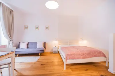 Ein Bett oder Betten in einem Zimmer der Unterkunft La Perla Vintage-Apartments