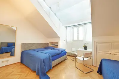 Ein Bett oder Betten in einem Zimmer der Unterkunft Penthouse im❤️Wiens