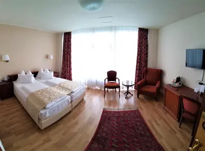 Ein Bett oder Betten in einem Zimmer der Unterkunft Hotel Domizil