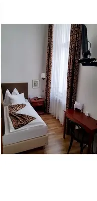 Ein Bett oder Betten in einem Zimmer der Unterkunft Hotel Domizil