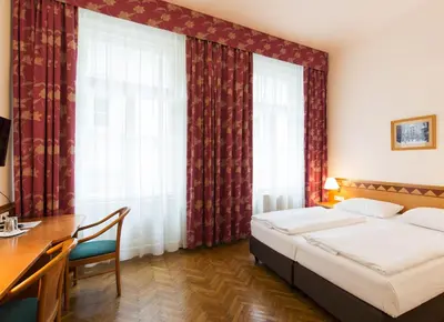 Ein Bett oder Betten in einem Zimmer der Unterkunft Hotel Post Wien