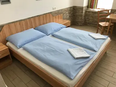 Ein Bett oder Betten in einem Zimmer der Unterkunft Hotel Pribitzer