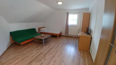 Ein Bett oder Betten in einem Zimmer der Unterkunft Lei's WOK