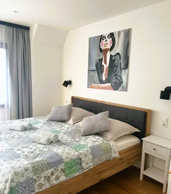 Ein Bett oder Betten in einem Zimmer der Unterkunft Boutiquehotel Landhaus am Kurpark