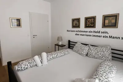 Ein Bett oder Betten in einem Zimmer der Unterkunft Triangle Apartments
