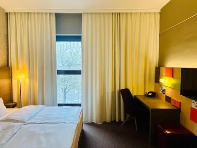 Ein Bett oder Betten in einem Zimmer der Unterkunft Max Brown Hotel 5th District, part of Sircle Collection