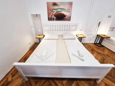 Ein Bett oder Betten in einem Zimmer der Unterkunft GAL Apartments Vienna