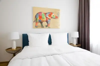 Ein Bett oder Betten in einem Zimmer der Unterkunft Studio Apartments Urania - Mai's Apartments