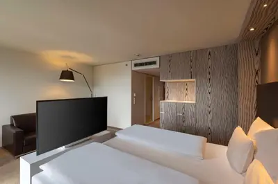 Ein Bett oder Betten in einem Zimmer der Unterkunft Doubletree by Hilton Vienna Schonbrunn