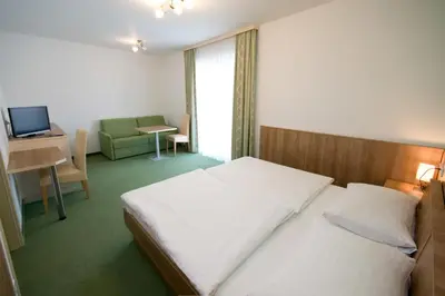 Ein Bett oder Betten in einem Zimmer der Unterkunft Hotel Bauer