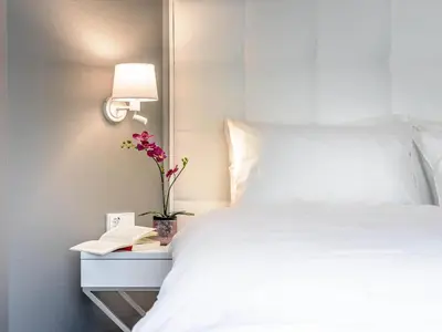 Ein Bett oder Betten in einem Zimmer der Unterkunft Mercure Hotel Raphael Wien