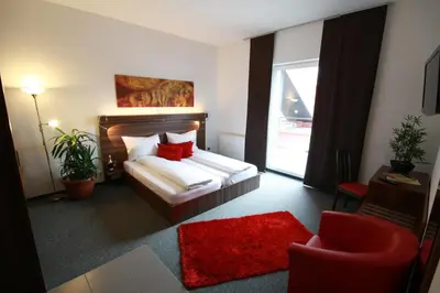 Ein Bett oder Betten in einem Zimmer der Unterkunft Hotel Fabrik Vösendorf