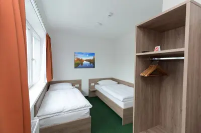 Ein Bett oder Betten in einem Zimmer der Unterkunft WinBudget 
