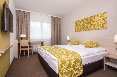 Ein Bett oder Betten in einem Zimmer der Unterkunft Hotel Das Himberg