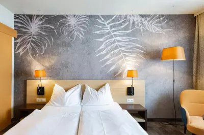 Ein Bett oder Betten in einem Zimmer der Unterkunft Hotel Das Himberg