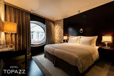 Ein Bett oder Betten in einem Zimmer der Unterkunft Hotel Topazz & Lamée