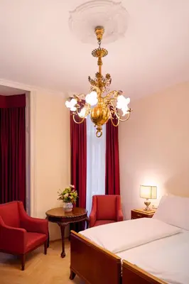 Ein Bett oder Betten in einem Zimmer der Unterkunft Graben Hotel