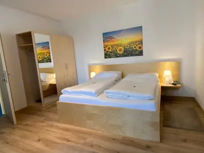 Ein Bett oder Betten in einem Zimmer der Unterkunft Pension Peterhof