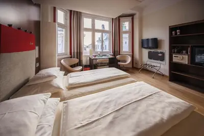 Ein Bett oder Betten in einem Zimmer der Unterkunft Hotel Rathaus - Wein & Design