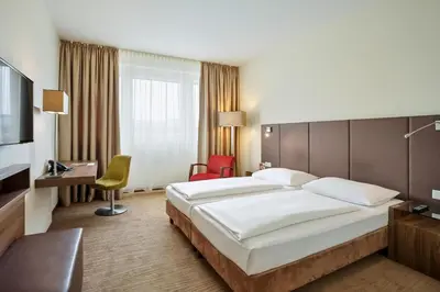Ein Bett oder Betten in einem Zimmer der Unterkunft Austria Trend Hotel Doppio Wien