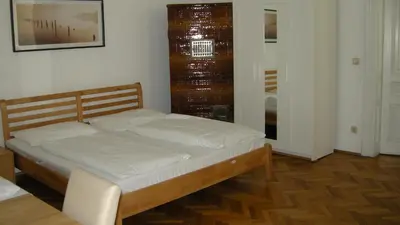 Ein Bett oder Betten in einem Zimmer der Unterkunft Pension Schottentor