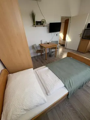 Ein Bett oder Betten in einem Zimmer der Unterkunft Pension Lizzi