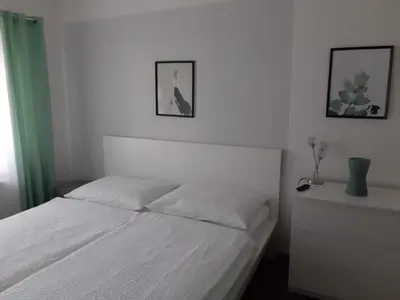 Ein Bett oder Betten in einem Zimmer der Unterkunft Ferienwohnung Leithaberg