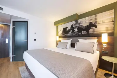 Ein Bett oder Betten in einem Zimmer der Unterkunft Leonardo Vienna Westbahnhof