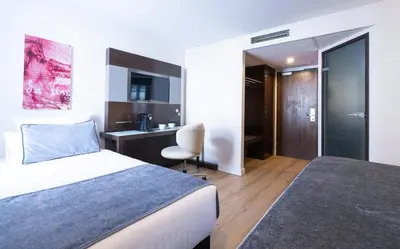 Ein Bett oder Betten in einem Zimmer der Unterkunft Leonardo Vienna Westbahnhof