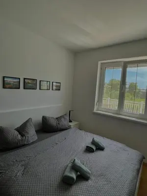 Ein Bett oder Betten in einem Zimmer der Unterkunft Hotel Mörbischerhof
