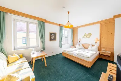 Ein Bett oder Betten in einem Zimmer der Unterkunft Hotel Krug