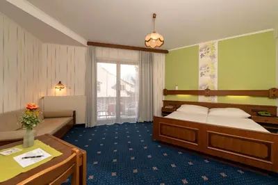 Ein Bett oder Betten in einem Zimmer der Unterkunft Pension Wienerstub'n