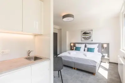 Ein Bett oder Betten in einem Zimmer der Unterkunft Cube Apartments by Wiener Stadthalle & U3 Metro