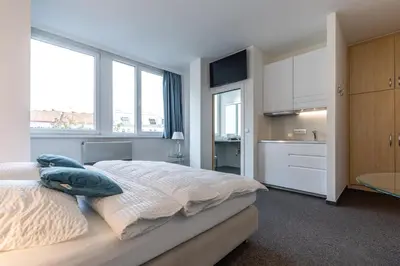 Ein Bett oder Betten in einem Zimmer der Unterkunft Cube Apartments by Wiener Stadthalle & U3 Metro